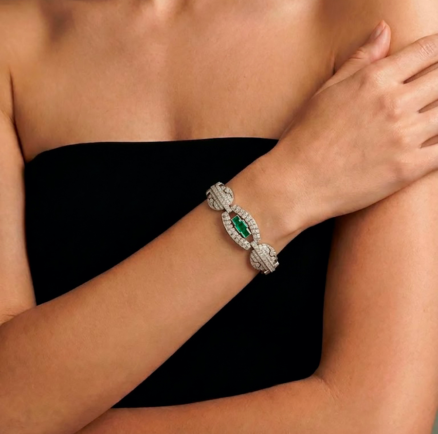 Art Deco-style bracelet with diamonds weighing approximately 10.00 ct and emeralds weighing approximately 3.50 ct.  